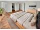 Main bedroom with wood flooring and neutral color scheme at 18206 N 86Th Ln, Peoria, AZ 85382