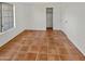 Simple bedroom with tile floor and a closet at 18206 N 86Th Ln, Peoria, AZ 85382