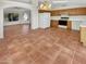 Spacious kitchen boasts tile floors, wood cabinets, and a breakfast nook at 18206 N 86Th Ln, Peoria, AZ 85382