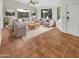 Bright living room featuring tile floors, neutral walls, and ample natural light at 18206 N 86Th Ln, Peoria, AZ 85382