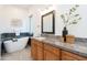 Spa-like bathroom showcases a freestanding tub, granite countertop, and modern finishes at 18206 W Solano Ct, Litchfield Park, AZ 85340