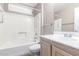 Bathroom with tub shower and wood vanity at 18212 N 136Th Ave, Sun City West, AZ 85375