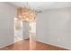 Dining room with hardwood floors and view to kitchen at 18212 N 136Th Ave, Sun City West, AZ 85375