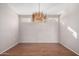 Simple dining room with hardwood floors and large windows at 18212 N 136Th Ave, Sun City West, AZ 85375