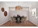 Elegant dining room with hardwood floors, chandelier, and modern decor at 18212 N 136Th Ave, Sun City West, AZ 85375