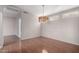 Dining room with hardwood floors and a modern chandelier at 18212 N 136Th Ave, Sun City West, AZ 85375