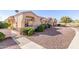 Single-story home with a landscaped yard and a gated entryway at 18212 N 136Th Ave, Sun City West, AZ 85375