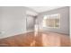 Bright living room with hardwood floors and large windows at 18212 N 136Th Ave, Sun City West, AZ 85375