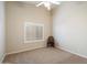 Simple bedroom with window shutters, ceiling fan and neutral wall color at 19275 N 88Th Way, Scottsdale, AZ 85255