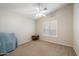 Charming bedroom with a small side table and window shutters at 19275 N 88Th Way, Scottsdale, AZ 85255