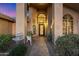 Elegant entryway with wrought-iron doors and a charming fountain at 19275 N 88Th Way, Scottsdale, AZ 85255