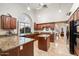 Kitchen with a large island and granite countertops at 19275 N 88Th Way, Scottsdale, AZ 85255