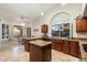 Kitchen with island, granite counters, and wood cabinets at 19275 N 88Th Way, Scottsdale, AZ 85255