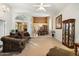 Spacious living room with high ceilings, fireplace and views into dining area at 19275 N 88Th Way, Scottsdale, AZ 85255