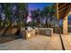 Gorgeous outdoor kitchen with stainless steel grills and stone countertops at 19275 N 88Th Way, Scottsdale, AZ 85255