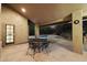 Covered patio with table and chairs overlooking pool at 19275 N 88Th Way, Scottsdale, AZ 85255