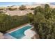 Aerial view of refreshing pool and lush landscaping at 19275 N 88Th Way, Scottsdale, AZ 85255