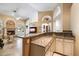 Wet bar with granite countertop and white cabinets at 19275 N 88Th Way, Scottsdale, AZ 85255