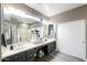 Modern bathroom with double vanities and a large mirror at 20509 N Enchantment Pass, Maricopa, AZ 85138