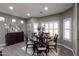 Elegant dining room with a round table and dark wood chairs at 20509 N Enchantment Pass, Maricopa, AZ 85138