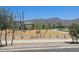 Community playground with play structures, shaded seating, and mountain views at 20624 N 226Th Dr, Surprise, AZ 85387