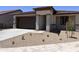 Charming single-Gathering home featuring a two-car garage and low-maintenance desert landscaping at 20634 N 226Th Dr, Surprise, AZ 85387
