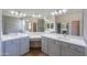 Bathroom with double vanity and modern light fixtures at 2142 W Enfield Way, Chandler, AZ 85286