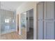 Bathroom with walk-in closet and modern finishes at 2142 W Enfield Way, Chandler, AZ 85286