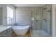 Modern bathroom with soaking tub and glass shower at 2142 W Enfield Way, Chandler, AZ 85286