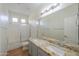 Bathroom with double vanity, granite countertop, and shower/tub combo at 2142 W Enfield Way, Chandler, AZ 85286