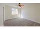 Bedroom with colorful ceiling fan and carpet flooring at 2142 W Enfield Way, Chandler, AZ 85286