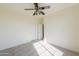 Bedroom with ceiling fan, carpet flooring, and double door closet at 2142 W Enfield Way, Chandler, AZ 85286