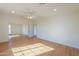 Spacious bedroom with mirrored closet doors and large windows at 2142 W Enfield Way, Chandler, AZ 85286