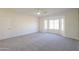 Light-filled bedroom featuring a bay window and plush carpeting at 2142 W Enfield Way, Chandler, AZ 85286