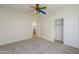 Bedroom featuring a ceiling fan, carpet, and access to a bathroom at 2142 W Enfield Way, Chandler, AZ 85286