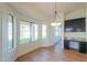 Bright dining area with built-in cabinetry and backyard views at 2142 W Enfield Way, Chandler, AZ 85286