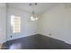 Dining room featuring a chandelier and large window at 2142 W Enfield Way, Chandler, AZ 85286