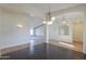 Open dining area with dark hardwood floors and chandelier at 2142 W Enfield Way, Chandler, AZ 85286