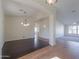 Formal dining area with dark hardwood floors and chandelier at 2142 W Enfield Way, Chandler, AZ 85286