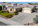 Single-story home with a two-car garage and landscaped front yard at 2142 W Enfield Way, Chandler, AZ 85286