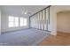 Spacious living room with carpeted floor and large windows at 2142 W Enfield Way, Chandler, AZ 85286