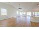 Spacious living room featuring hardwood floors, high ceilings, and ceiling fans at 2142 W Enfield Way, Chandler, AZ 85286