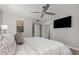 Relaxing bedroom with a comfy bed and wall-mounted TV at 2146 W Isabella Ave # 252, Mesa, AZ 85202