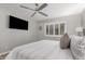 Spacious bedroom with a TV and ceiling fan at 2146 W Isabella Ave # 252, Mesa, AZ 85202