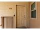 Condo building entryway with door and security features at 2146 W Isabella Ave # 252, Mesa, AZ 85202