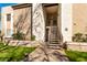 Exterior view of condo building with stairs leading to entrance and landscaping at 2146 W Isabella Ave # 252, Mesa, AZ 85202