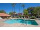 Inviting community pool with ample lounge chairs at 2146 W Isabella Ave # 252, Mesa, AZ 85202