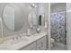 Shared bathroom with dual sinks and updated finishes at 22847 E Sonoqui Blvd, Queen Creek, AZ 85142