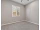 Bright and airy bedroom with neutral color scheme and plantation shutters at 22847 E Sonoqui Blvd, Queen Creek, AZ 85142