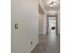 Bright hallway with tile flooring and modern light fixtures at 22847 E Sonoqui Blvd, Queen Creek, AZ 85142